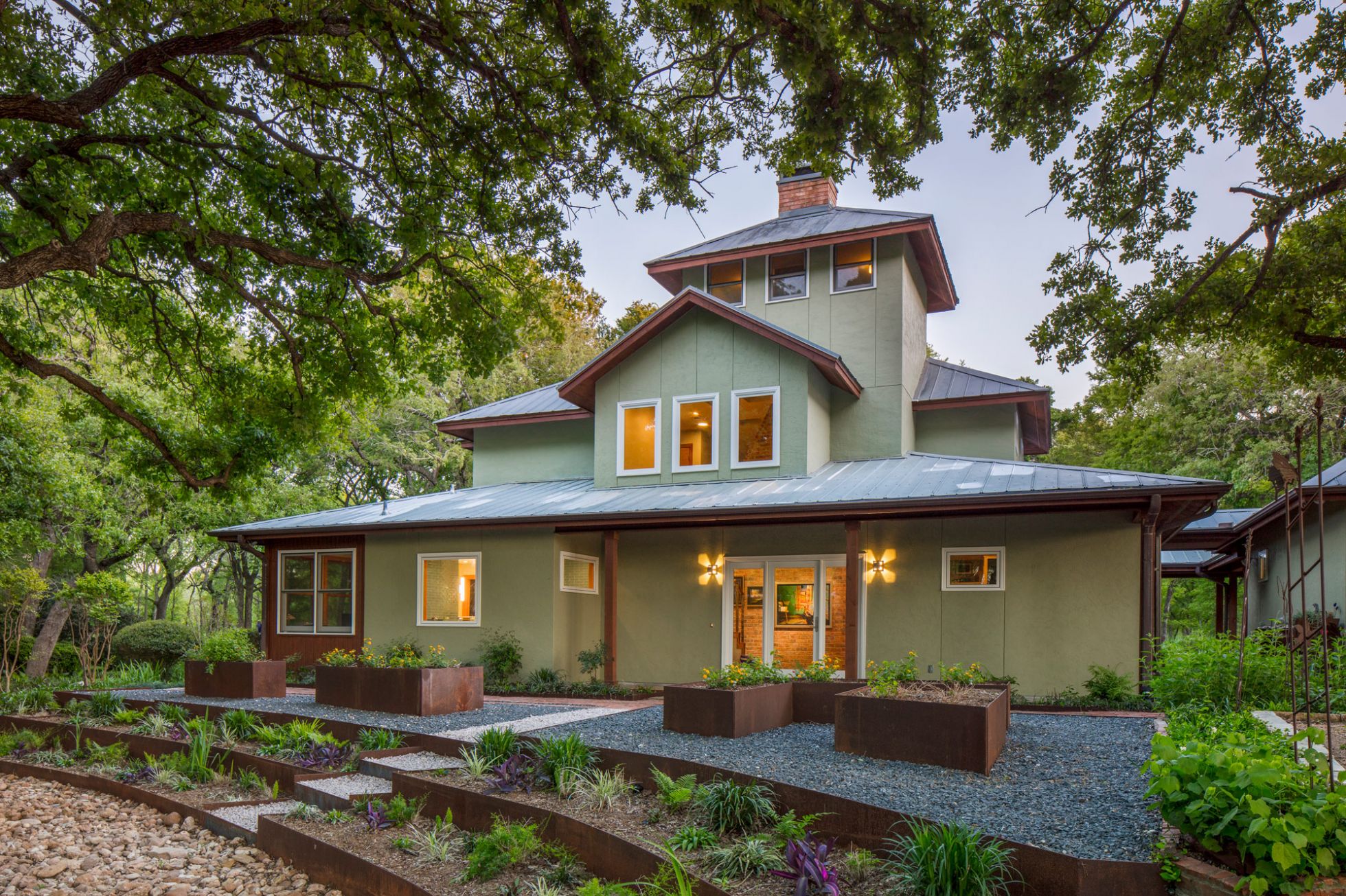 Exterior of Light Green Home in Nature Space