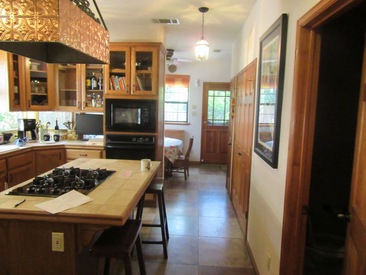 Dark Kitchen with Dining Room View