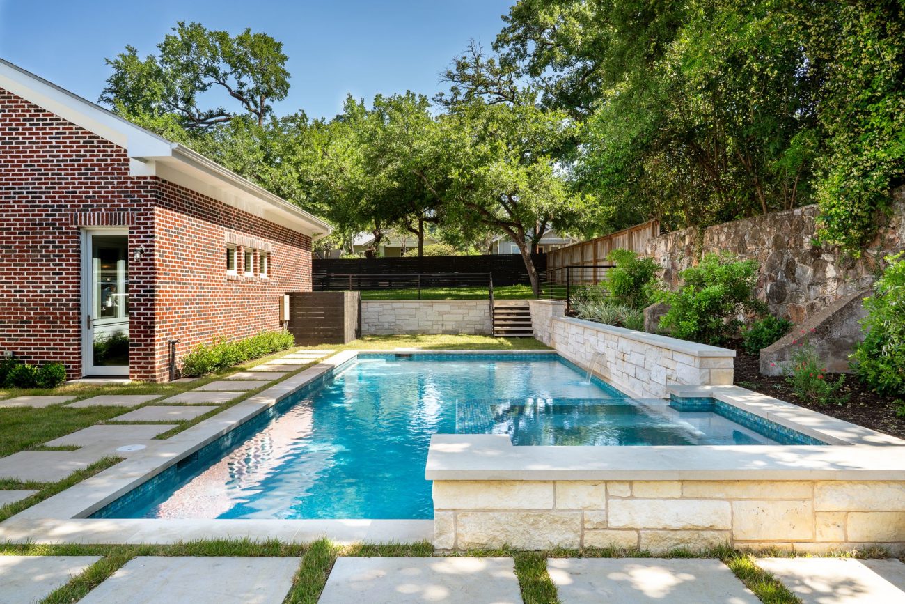 Large Backyard Residential Pool Surrounded by Trees